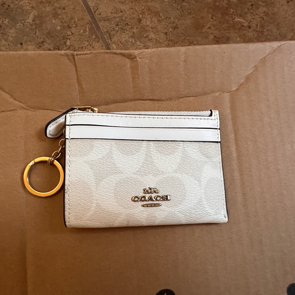 Coach Ivory Wristlet with Gold Ring